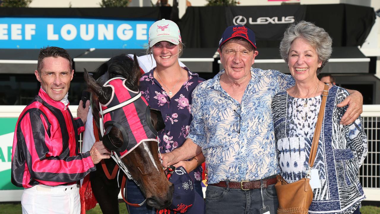 Chris Whiteley returns to scale and is congratulated by trainers Ronnie and Janel Ryan after winning the 2021 Cairns Cup riding Tutelage, at the Cairns Jockey Club, Cannon Park. Picture: Brendan Radke