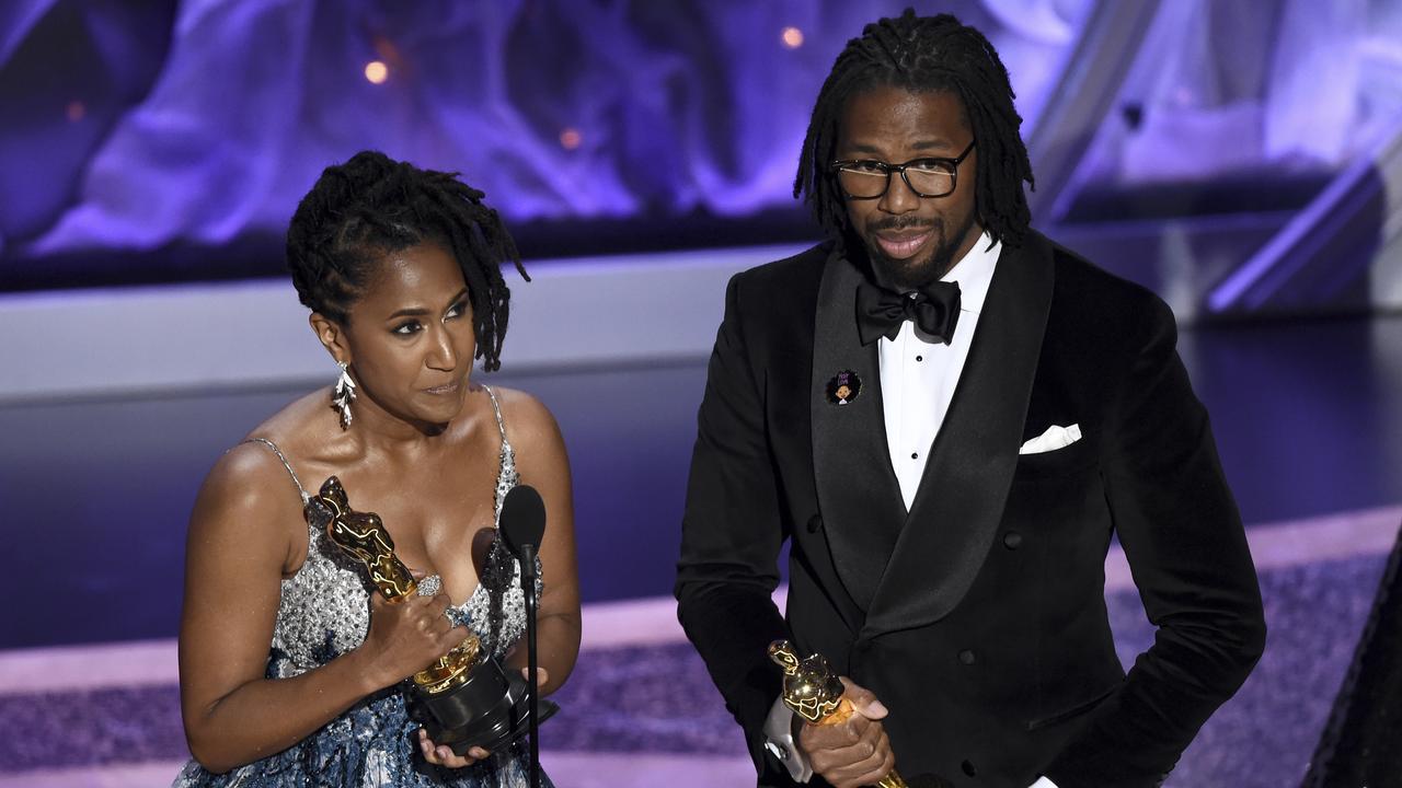 Best Animated Short Film: <i>Hair Love. </i>Karen Rupert Toliver and Matthew A. Cherry accept the award. Picture: AP