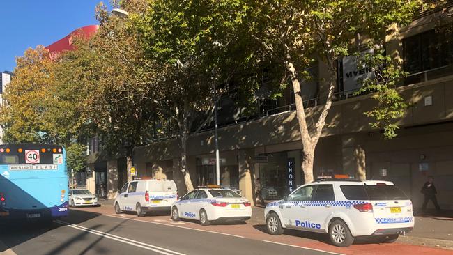 Police at the Argyle St entrance to Westfield Parramatta.