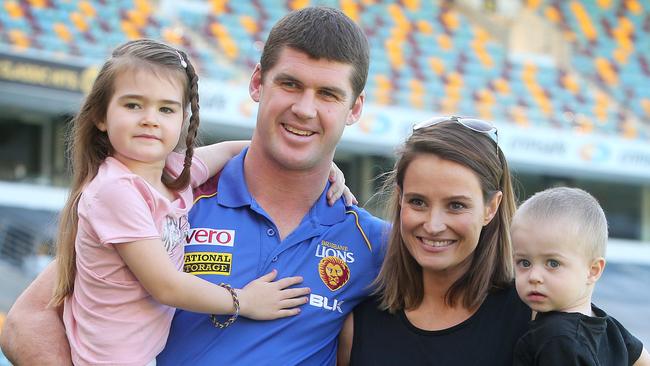 Jonathan Brown with daughter Olivia, wife Kylie and son Jack, as he announced his retirement from AFL. Pic: Jono Searle.