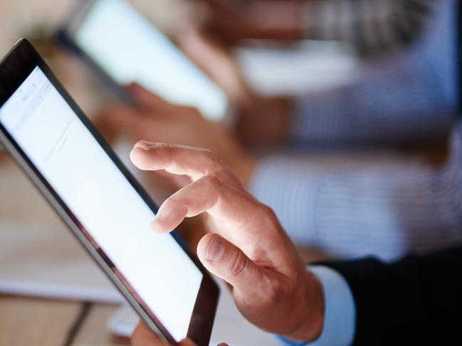 Closeup shot of businesspeople using digital tablets during a conferencehttp://195.154.178.81/DATA/i_collage/pi/shoots/806056.jpg