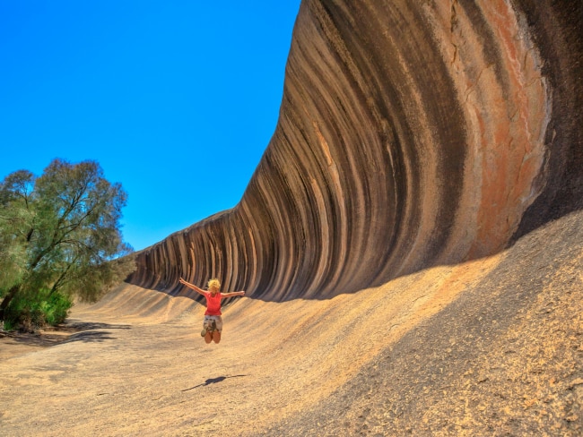 <span>25/50</span><h2>Wave Rock, WA</h2><p>Calling all surf bros: It’s time to head to the outback. Wave Rock’s 2.6 billion year old form cuts across Hyden Wildlife Park, curving like a frozen ocean wave about to crash. This ancient natural sculpture has Dreamtime significance to the Ballardong people, and is a very special place.</p>