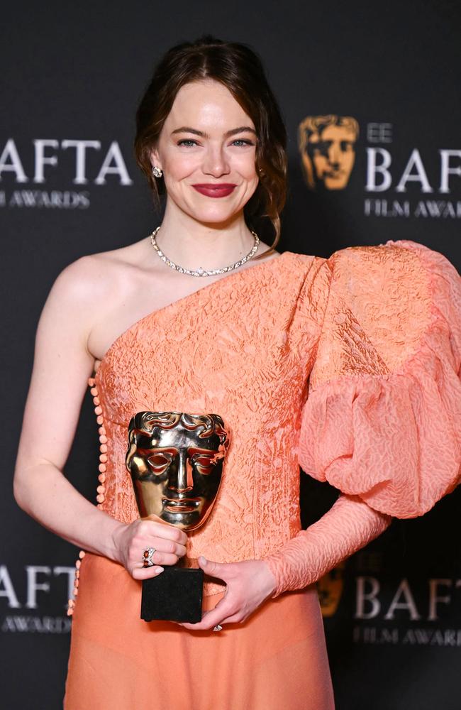 Emma Stone poses with the Leading Actress Award. Picture: Getty Images