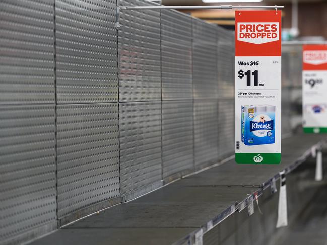 Empty shelves normally stocked with toilet paper rolls at Woolworths Supermarket in Parramatta, Sydney. Picture: James Gourley