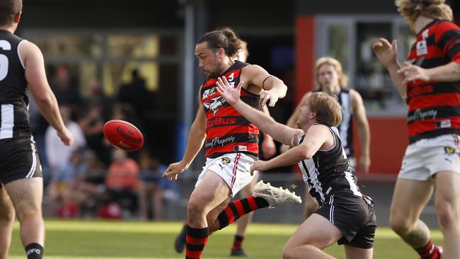 Thor Boscott (Lauderdale) gets a kick away from Matt Joseph (Glenorchy). Picture: Nikki Davis-Jones