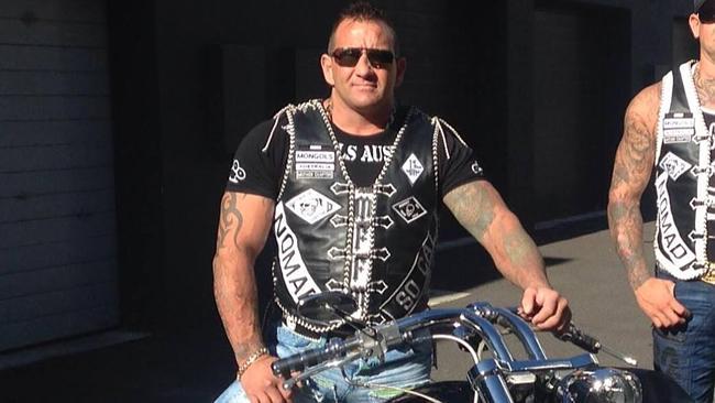 Bikie held over home invasion