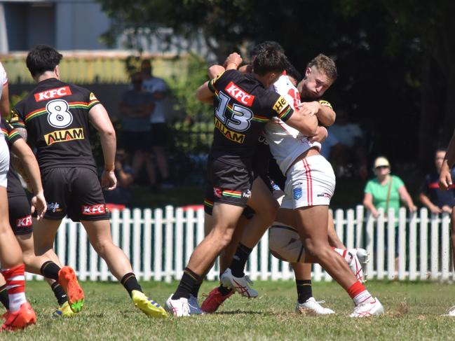 Loko Tonga is tackled by Billy Phillips. Picture: Sean Teuma/NewsLocal