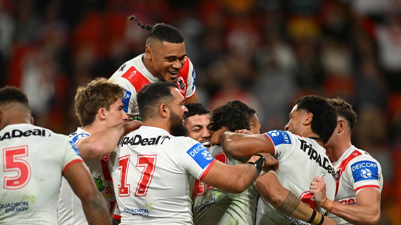 BRISBANE, AUSTRALIA - JULY 13: Dragons celebrate a Jaydn Su'A try during the round 19 NRL match between Brisbane Broncos and St George Illawarra Dragons at Suncorp Stadium, on July 13, 2024, in Brisbane, Australia. (Photo by Albert Perez/Getty Images)