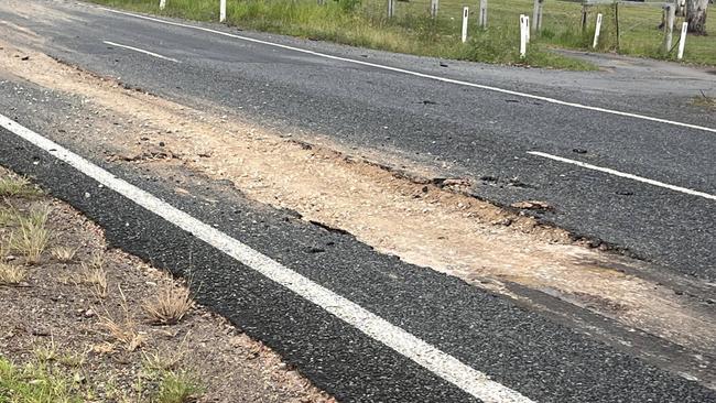 The falling machinery carved a metres-long chunk out of Maryborough-Biggenden Rd, leaving it with significant damage.