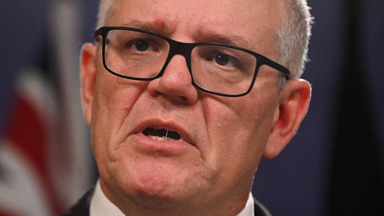 Former prime minister Scott Morrison defends his actions at a press conference on Wednesday. Picture: Steven Saphore / AFP