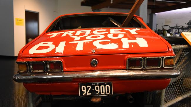 'Tracey You Bitch': Darwin resident John Garner's crushed Holden Torana has been recreated for the Museum and Art Gallery of the Northern Territory's reopened Cyclone Tracy exhibition. Picture: Alex Treacy