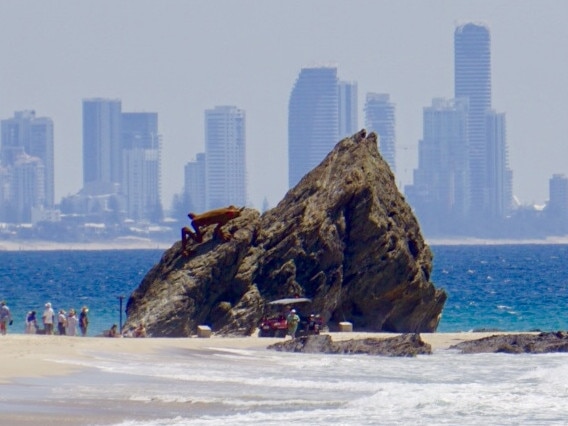 Currumbin Rock at the mouth of Currumbin Creek providesa stark contrast the skyline of Surfers Paradise. Photo: KEITH HALFORD, Palm Beach