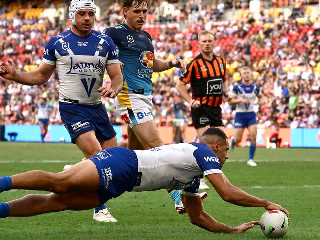 BRISBANE, AUSTRALIA - MAY 04: Jacob Kiraz of the Bulldogs scores his third try during the round nine NRL match between the Gold Coast Titans and Canterbury Bulldogs at Suncorp Stadium on May 04, 2025, in Brisbane, Australia. (Photo by Hannah Peters/Getty Images)