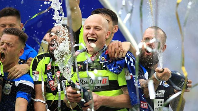 Aaron Mooy celebrates Huddersfield's Premier League promotion.