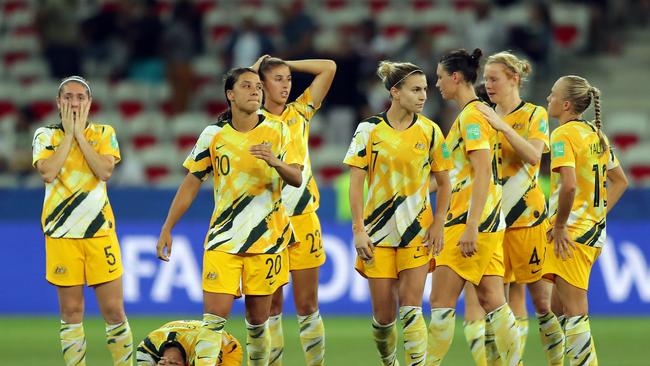 The Australia players look dejected after losing the penalty shootout. Picture: Getty