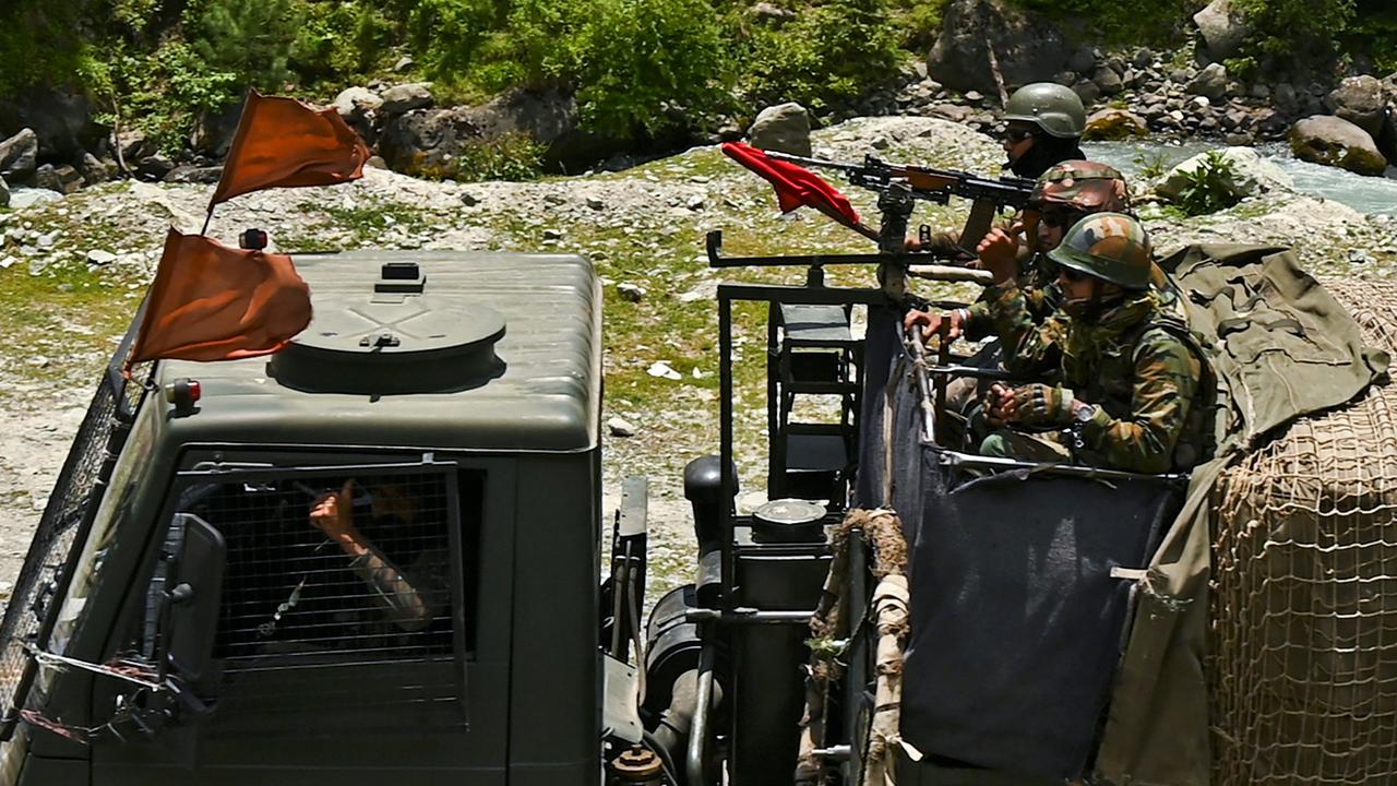 Indian army soldiers ride in a convoy along a highway leading towards Leh, bordering China, in Gagangir on June 17, 2020. Picture: Tauseef Mustafa/AFP