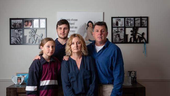 The Postle family in their home filled with photographs and memorabilia of their daughter and sister, Alyssa, who was killed in a car crash at 17. Picture: David Kelly.