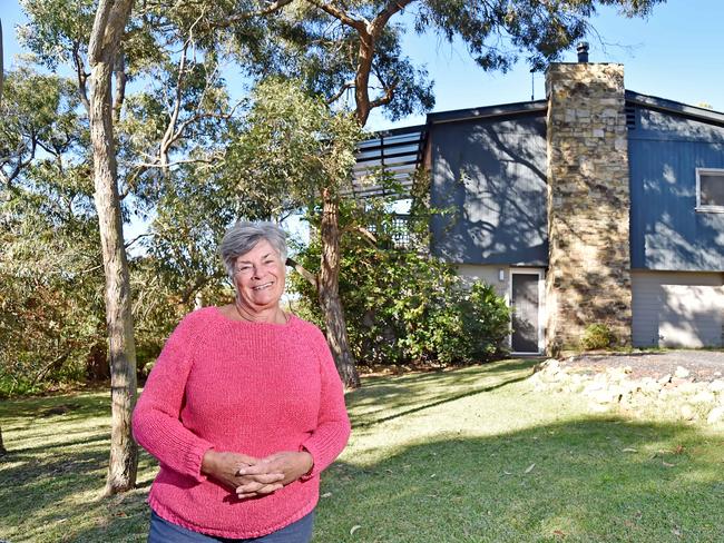 MANLY DAILY/AAP. Penny Paterson outside her home at 14 Wakehurst Parkway at Frenchs Forest on Tuesday, May 28. Nine homeowners on the corner of Frenchs Forest Rd and Wakehurst Parkway, opposite the new Northern Beaches Hospital, are trying to circumnavigate the delayed rezoning by selling together. AAP IMAGE / Troy Snook)