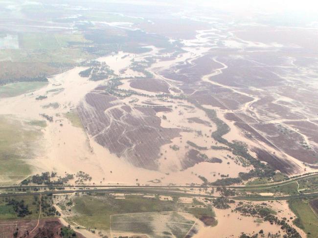 Floodwaters creep closer to the north west NSW town of Moree. A flooded Newell Hwy south of Moree on the road to Narrabri