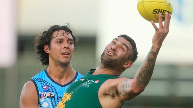 Raphael Clarke grabs a one-handed mark for St Mary’s in their win over the Darwin Buffaloes at TIO stadium. Picture: GLENN CAMPBELL