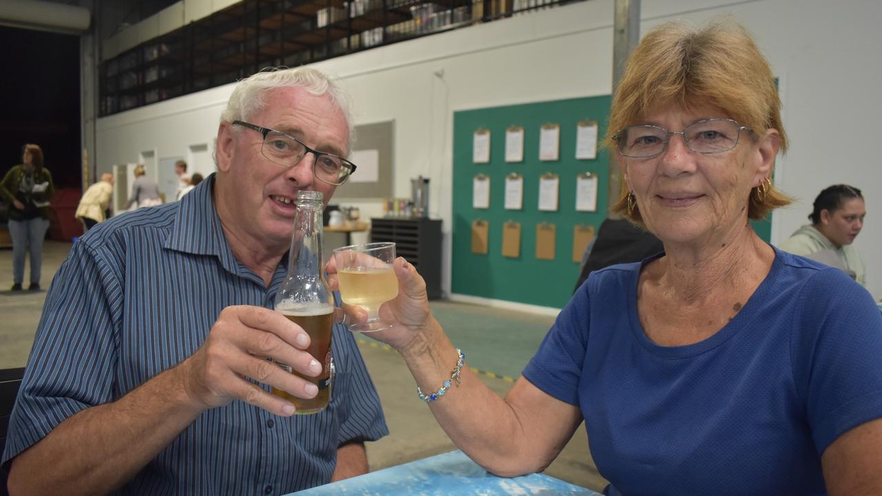 (L) Robbie and Chris Macmillan enjoy drinks at the opening of the Hervey Bay Neighbourhood Centre's Neighbourhood Hive. Photo: Stuart Fast