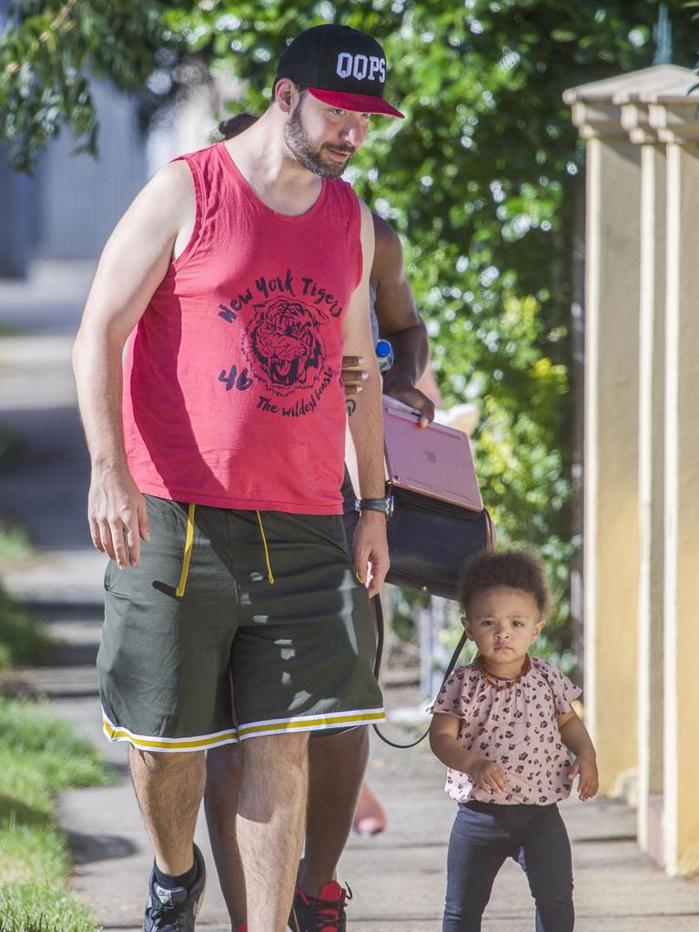 Serena Williams and her husband Alexis Ohanian enjoy an afternoon walk with their 1-year-old daughter Alexia Olympia. Serena's daughter looked seriously cute, toddling her way down the footpath, wearing Nike sneakers like her Mummy. Picture: MediaMode 