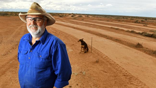 Marree Hotel owner Phil Turner at the site of the restored Marree man outline.