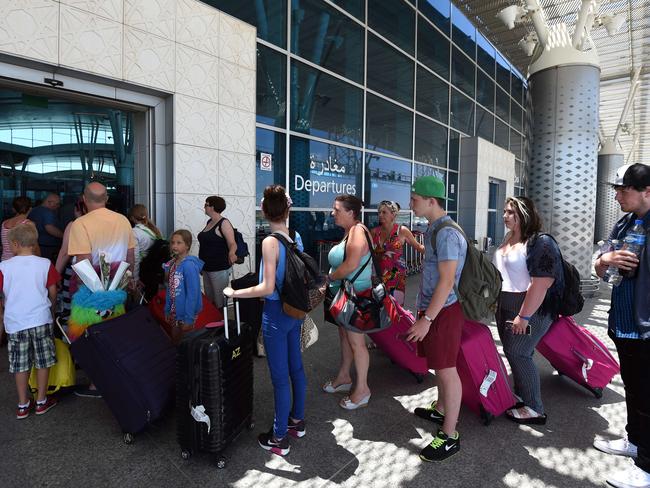British tourists depart from Enfidha International airport after the attack.