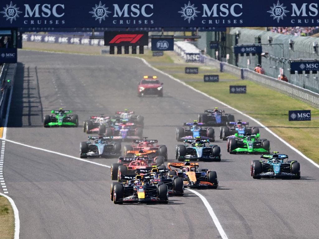 Verstappen (front L) leads after the restart. Picture: AFP