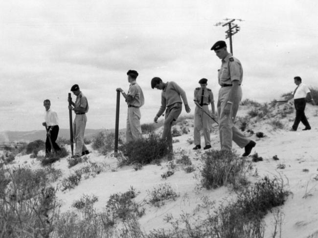 Some of the 56 police cadets comb the sandhills north of Glenelg in 1966 in the search for the children.