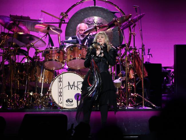 Fleetwood Mac performing in Sydney, Lindsey Buckingham - lead guitar, rhythm guitar, vocals, Stevie Nicks - vocals, tambourine, Christine McVie - vocals, keyboards, maracas, accordion on 
