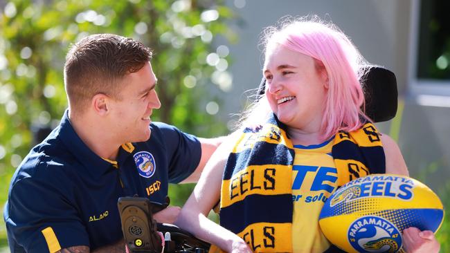 Parramatta Eels player Cameron King meets Northcott clients Ash McDonald (27) Cameron is an ambassador for Northcott and visits the disability service provider for DoSomething Day 2018. Parramatta, Wednesday, July 25th 2018. Parramatta Eels hooker Cameron King is an ambassador for Northcott- a disability service provider. (AAP Image / Angelo Velardo)