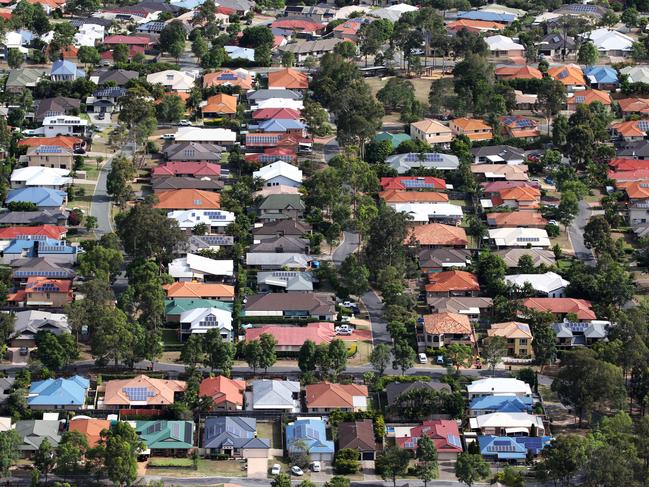 Aerial images of suburban house in South-West Brisbane. Generic houses, roof, solar panel, leafy suburb.