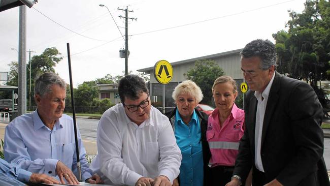 Checking out plans for the Walkerston Bypass: Mackay mayor Greg Williamson, Dawson MP George Christensen, Capricornia MP Michelle Landry, RAAG member Carol Single (from Single Transport Services) and Infrastructure Minister Darren Chester. Picture: Luke Mortimer