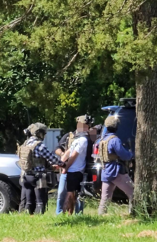 Police take a man into custody after surrounding a home in Toowoomba, Queensland. January 5, 2025