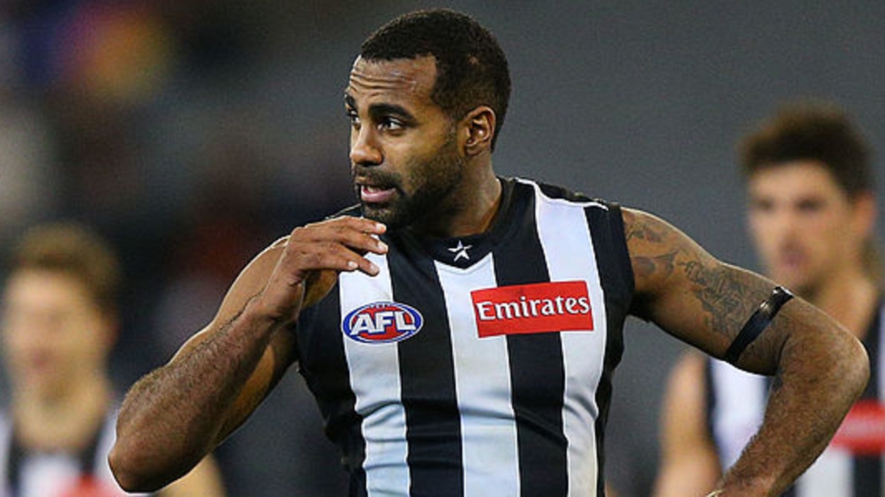 MELBOURNE, AUSTRALIA - JULY 27: Heritier Lumumba (L) of the Magpies walks off after being defeated during the round 18 AFL match between the Collingwood Magpies and the Adelaide Crows at Melbourne Cricket Ground on July 27, 2014 in Melbourne, Australia. (Photo by Michael Dodge/Getty Images)