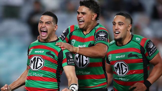 SYDNEY, AUSTRALIA - MARCH 25: Cody Walker of the Rabbitohs celebrates with Latrell Mitchell and Keaon Koloamatangi of the Rabbitohs after scoring a try during the round three NRL match between the South Sydney Rabbitohs and the Sydney Roosters at Accor Stadium, on March 25, 2022, in Sydney, Australia. (Photo by Matt King/Getty Images) *** BESTPIX ***