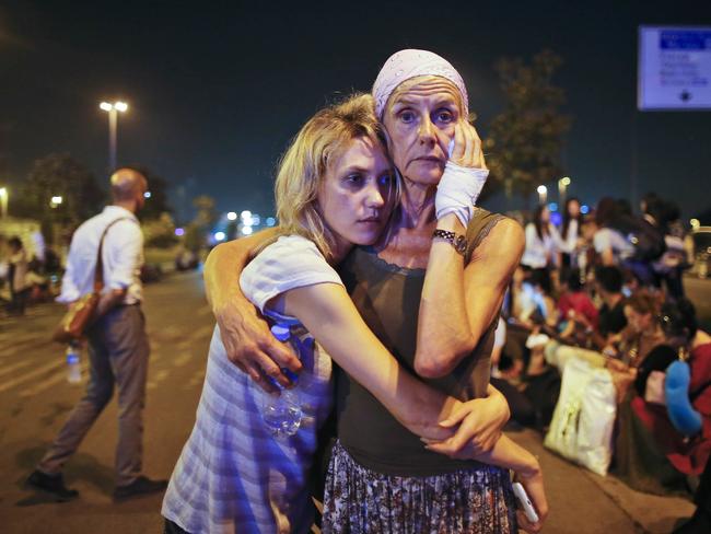 Passengers embrace after the bombing of Istanbul’s Ataturk International Airport on June 29. Picture: Emrah Gurel/AP