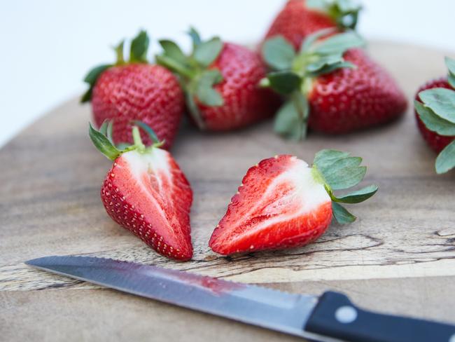 Strawberries Australia president John Calle is urging consumers to continue buying the delicious fruit but cut it up before eating. Picture: Erik Anderson