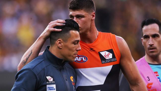 Jonathon Patton consoles Dylan Shiel after the preliminary final. Picture: Phil Hillyard