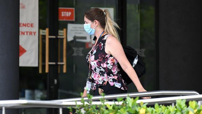 A woman enters the Hotel Grand Chancellor in Spring Hill, Brisbane. Picture: Dan Peled