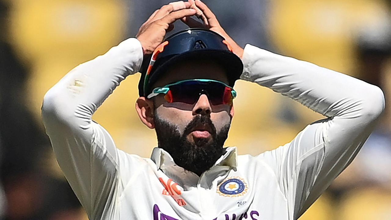 India's Virat Kohli had plenty to smile about on Day 1. Photo by Indranil MUKHERJEE / AFP.