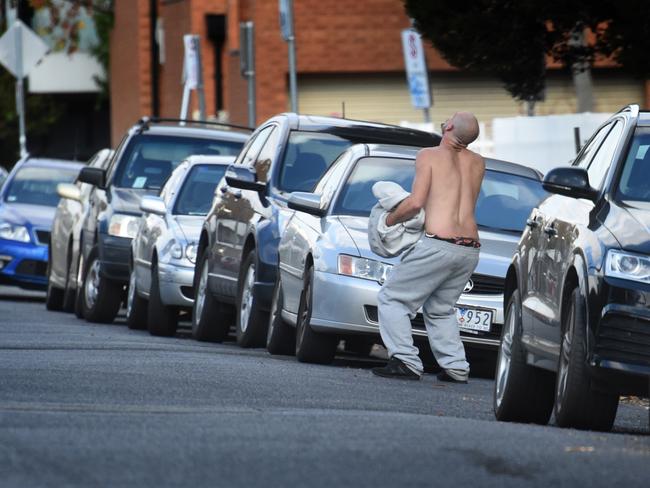 A drug-affected man staggers across a Richmond street. Picture: Tony Gough