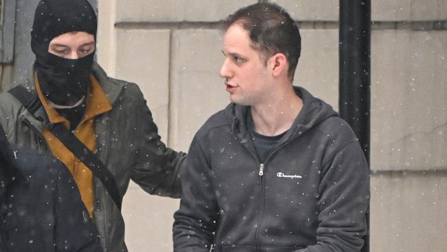 US journalist Evan Gershkovich, right, is escorted out of the Lefortovsky Court building in Moscow last month. Picture: AFP