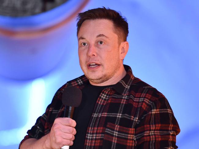 Elon Musk, co-founder and chief executive officer of Tesla Inc., speaks during an unveiling event for the Boring Company Hawthorne test tunnel in Hawthorne, south of Los Angeles, California on December 18, 2018. - Musk explained that the snail moves 14 times faster than a tunnel-digging machine.  On Tuesday night December 18, 2018, Boring Co. officially opened the Hawthorne tunnel, a preview of Elon Musk's larger vision to ease L.A. traffic. (Photo by Robyn Beck / POOL / AFP)