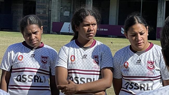 The Queensland girls listen during a team talk.