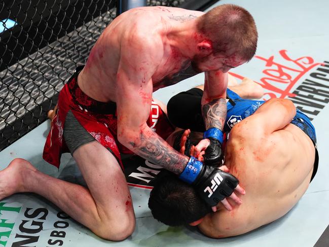 Tom Nolan finishes Victor Martinez. Picture: Chris Unger/Zuffa LLC via Getty Images