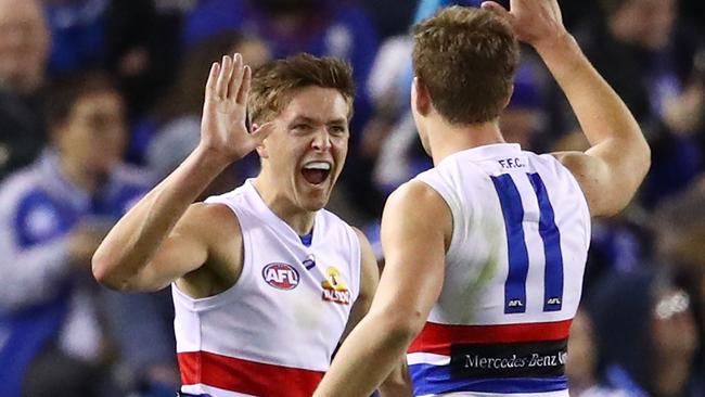 Fergus Greene celebrates after kicking a goal with Jack Macrae against North Melbourne last weekend. Picture: Getty Images