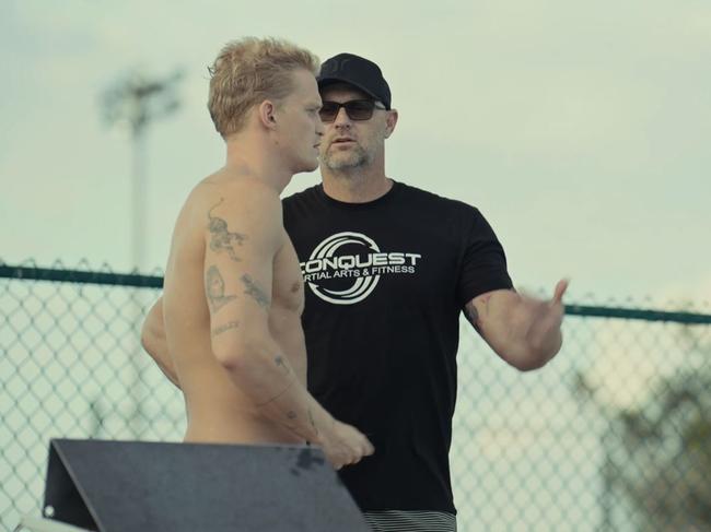 Cody Simpson and coach Brett Hawke in <i>Head Above Water</i>