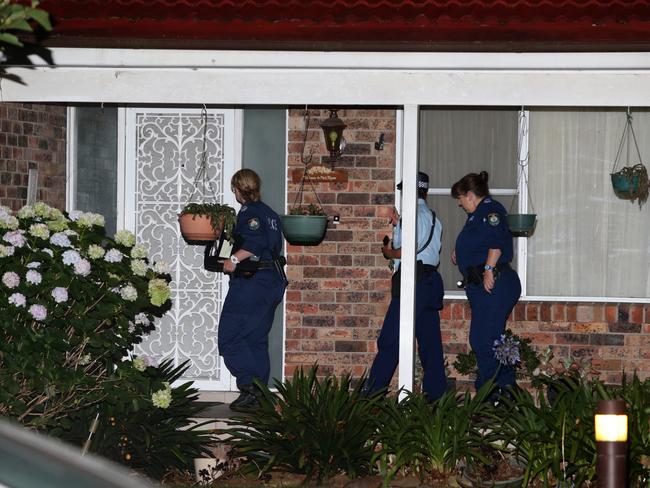 Police at the home of former judge Richard Gee who died after being found unconscious in the backyard pool. Picture: Bill Hearne